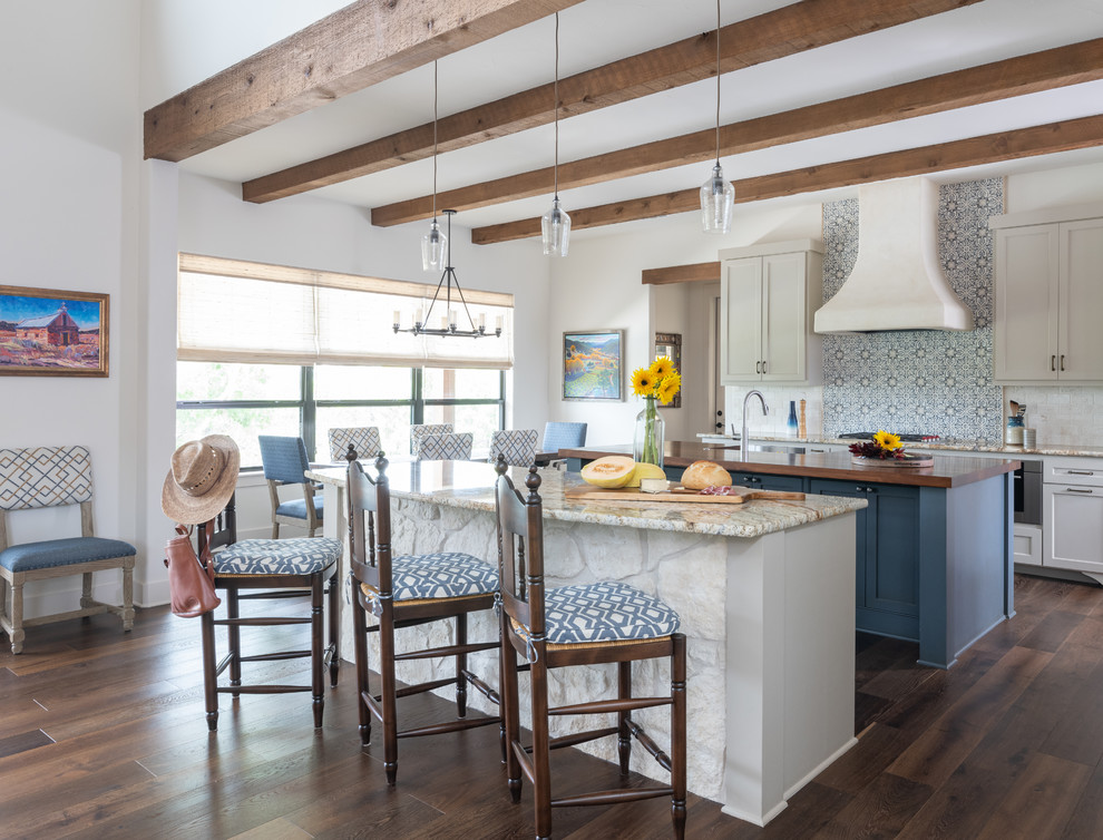 Inspiration for a mid-sized southwestern dark wood floor and brown floor kitchen remodel in Austin with shaker cabinets, granite countertops, two islands, ceramic backsplash, gray cabinets, multicolored backsplash and multicolored countertops