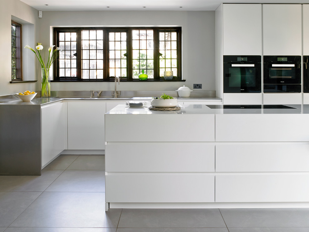 Photo of a contemporary grey and cream kitchen in London.
