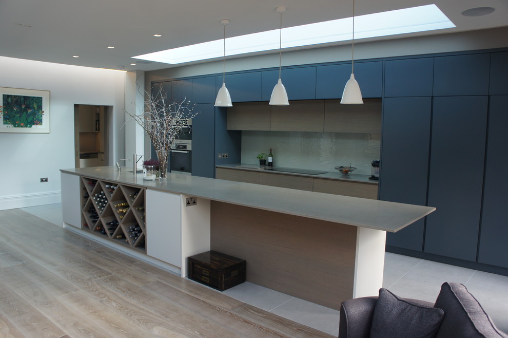 Inspiration for a large contemporary kitchen/diner in London with an island.