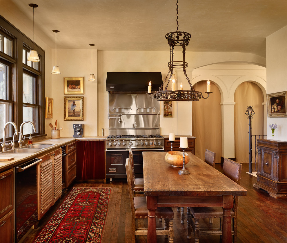 Tuscan kitchen photo in Austin with a drop-in sink, recessed-panel cabinets and dark wood cabinets