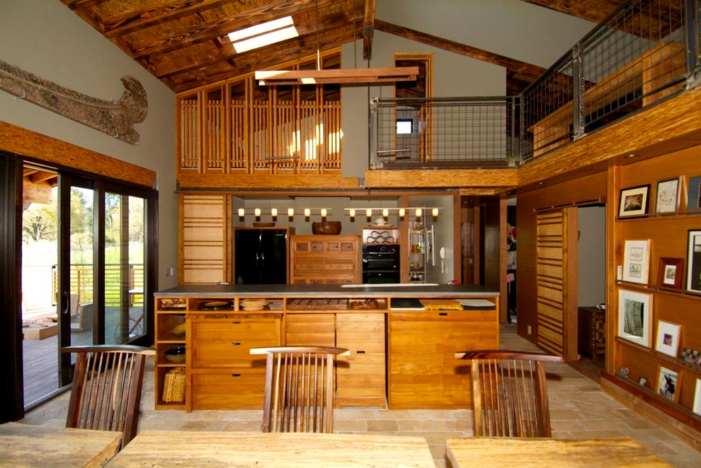 This is an example of a large traditional single-wall open plan kitchen in San Francisco with flat-panel cabinets, medium wood cabinets, integrated appliances, ceramic flooring and an island.