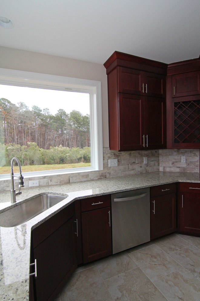 Example of a large trendy l-shaped ceramic tile open concept kitchen design in Raleigh with an undermount sink, shaker cabinets, red cabinets, granite countertops, gray backsplash, ceramic backsplash, stainless steel appliances and an island