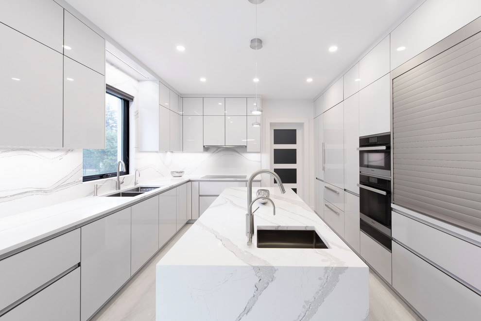 This is an example of a medium sized modern kitchen in Toronto with flat-panel cabinets, white cabinets, white splashback, an island and beige floors.