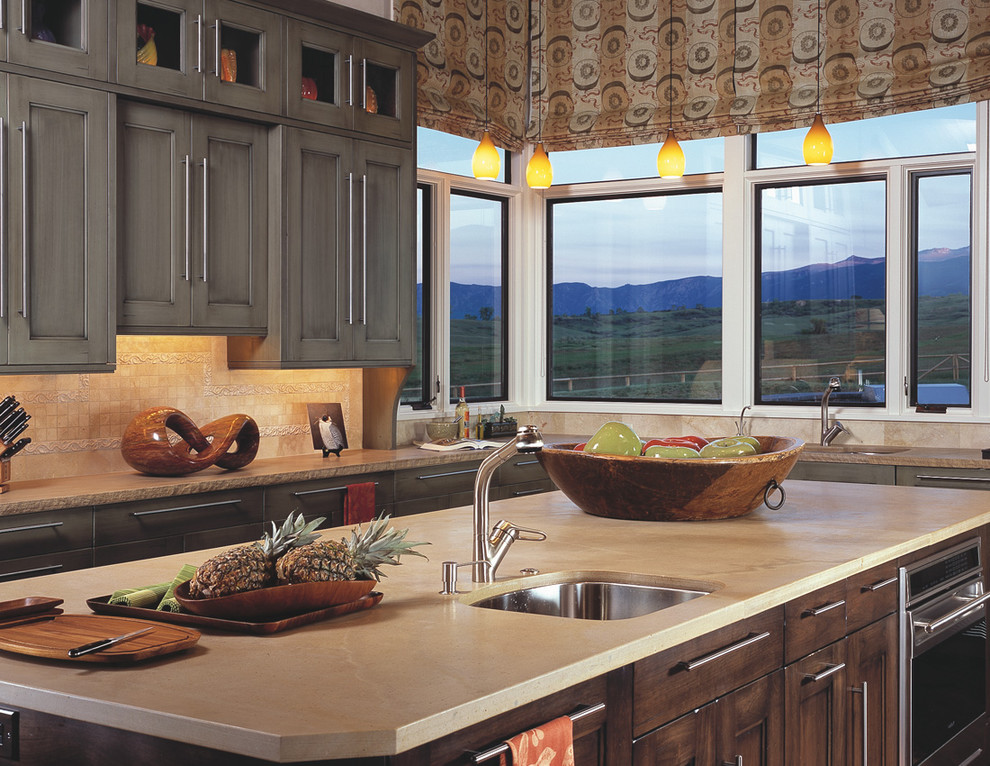 Traditional kitchen in Denver with a submerged sink, recessed-panel cabinets and beige splashback.