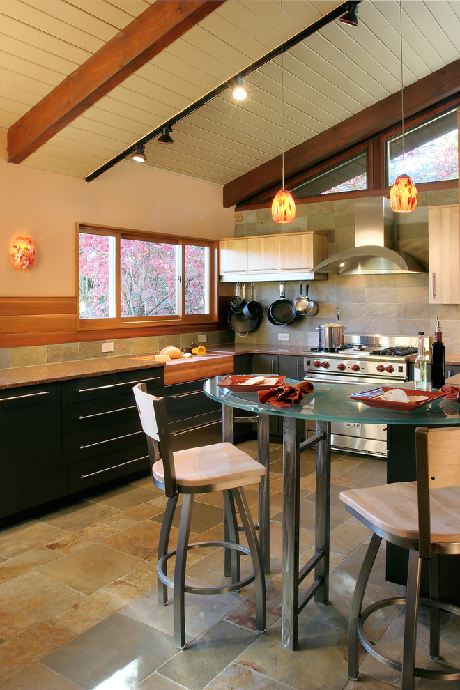 Photo of a contemporary kitchen in Portland with flat-panel cabinets and black cabinets.