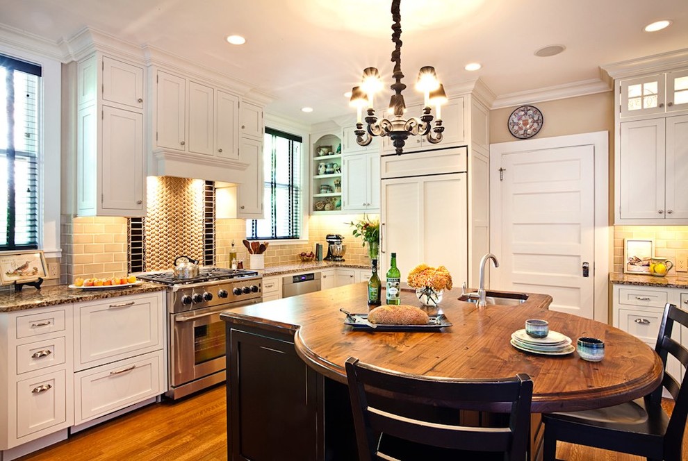 Kitchen - kitchen idea in Atlanta with wood countertops