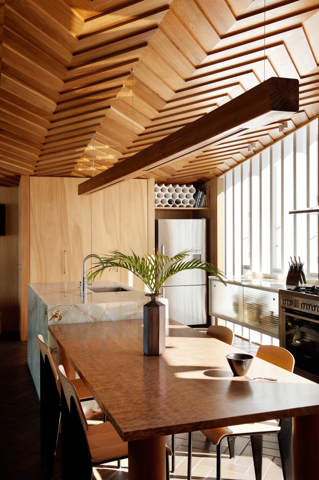 Идея дизайна: кухня среднего размера в современном стиле с обеденным столом