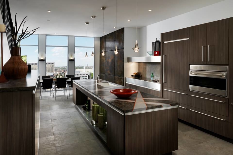 This is an example of a large contemporary u-shaped kitchen/diner in Houston with a built-in sink, flat-panel cabinets, dark wood cabinets, brown splashback, ceramic splashback, stainless steel appliances, ceramic flooring and an island.