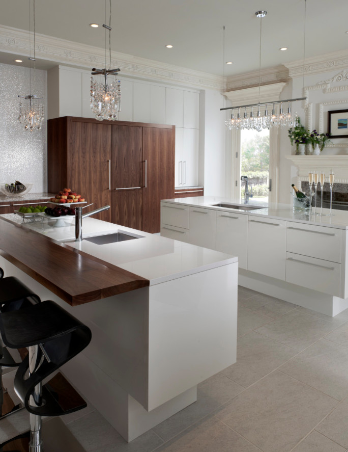 Inspiration for a mid-sized modern galley slate floor eat-in kitchen remodel in Houston with a single-bowl sink, flat-panel cabinets, yellow cabinets, solid surface countertops, stainless steel appliances and two islands