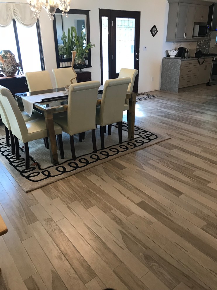 Photo of a large nautical kitchen/dining room in Miami with porcelain flooring and beige floors.