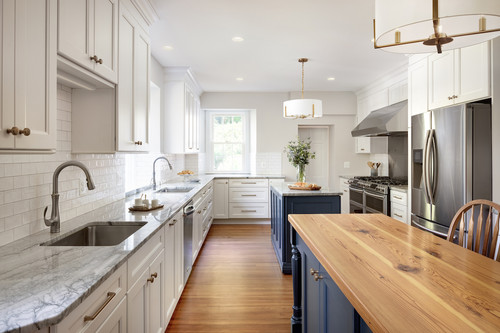 Stylish kitchen with white shaker cabinets, marble countertops, and blue island – premium Kitchen & Bathroom Cabinets design