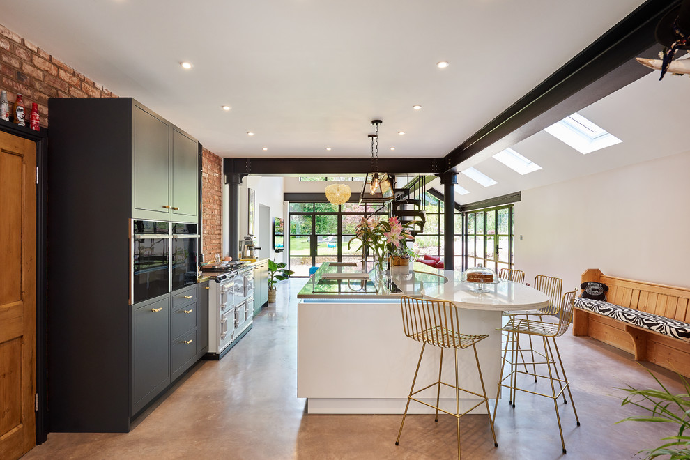 Expansive contemporary single-wall open plan kitchen in West Midlands with flat-panel cabinets, concrete flooring, an island, a submerged sink, black cabinets, brick splashback, white appliances, marble worktops, grey floors and multicoloured worktops.