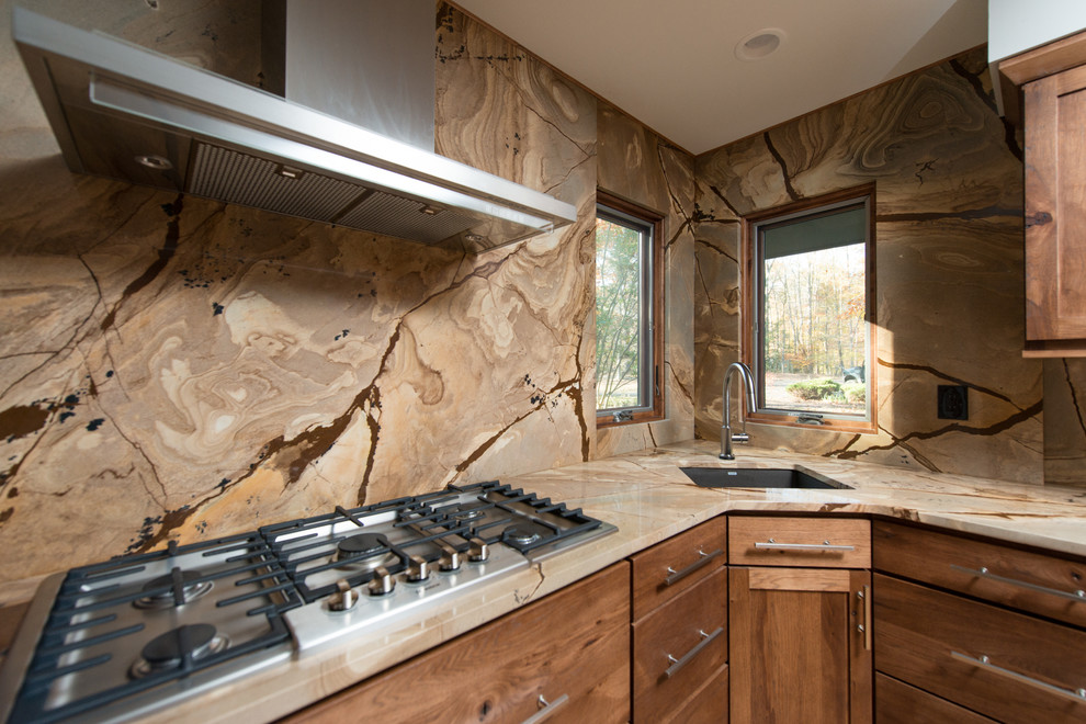 Inspiration for a mid-sized contemporary l-shaped light wood floor open concept kitchen remodel in DC Metro with an undermount sink, flat-panel cabinets, medium tone wood cabinets, quartzite countertops, brown backsplash, stone slab backsplash, stainless steel appliances and an island