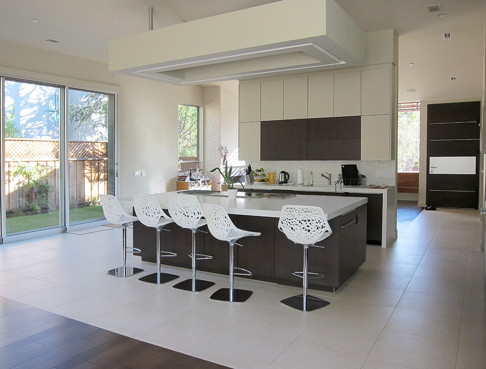 Photo of a modern kitchen in San Francisco with flat-panel cabinets and beige cabinets.