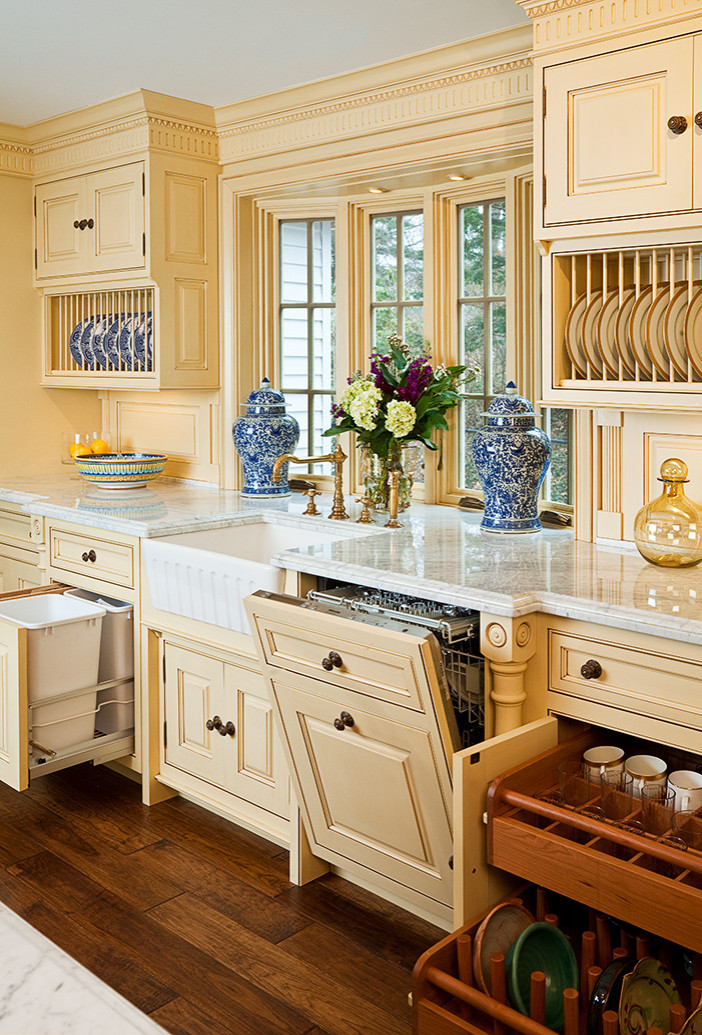 Custom, in-cabinet dish drying rack. Water drips directly into the sink. -  Transitional - Kitchen - Seattle - by Genay Bell Interior Design