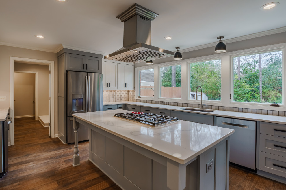 Inspiration for a mid-sized transitional l-shaped vinyl floor and brown floor eat-in kitchen remodel in Other with an undermount sink, shaker cabinets, gray cabinets, quartz countertops, gray backsplash, marble backsplash, stainless steel appliances, an island and white countertops