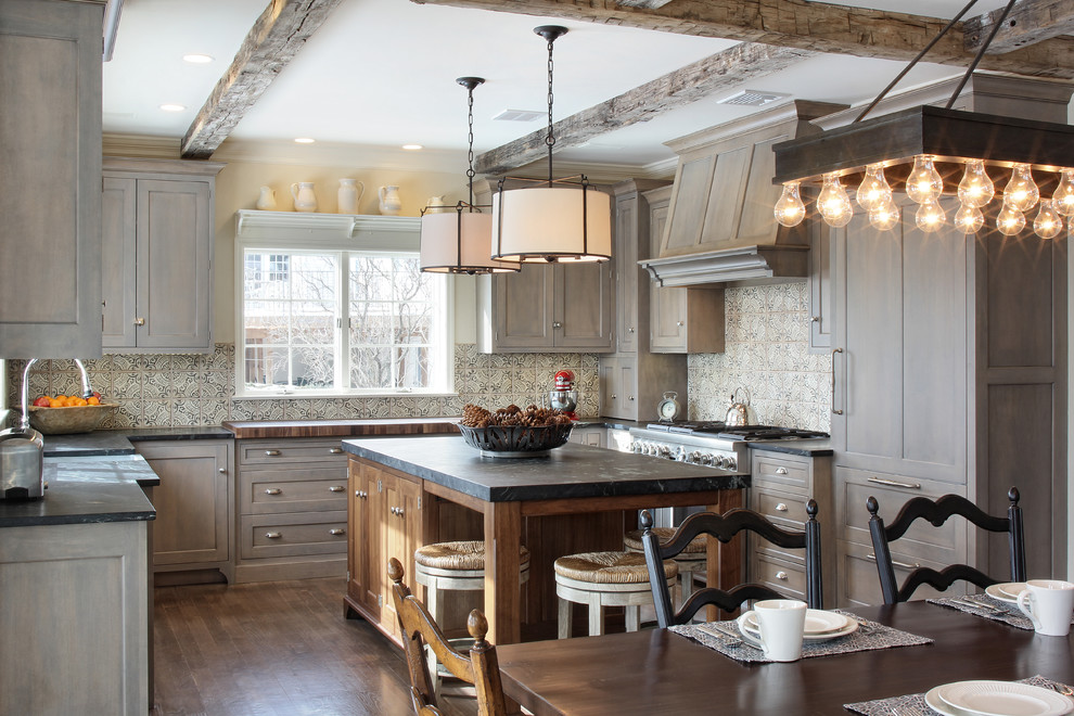 Example of a large mountain style u-shaped medium tone wood floor eat-in kitchen design in Philadelphia with a farmhouse sink, gray cabinets, quartzite countertops, multicolored backsplash, terra-cotta backsplash and stainless steel appliances