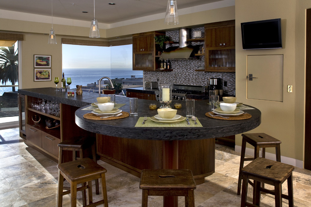 Contemporary kitchen in Orange County with glass-front cabinets, dark wood cabinets and multi-coloured splashback.