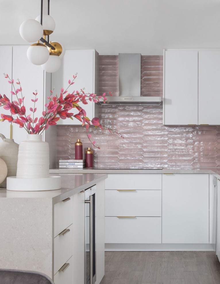 Inspiration for a contemporary u-shaped kitchen in Toronto with a submerged sink, flat-panel cabinets, white cabinets, engineered stone countertops, pink splashback, ceramic splashback, medium hardwood flooring, an island, grey floors and grey worktops.
