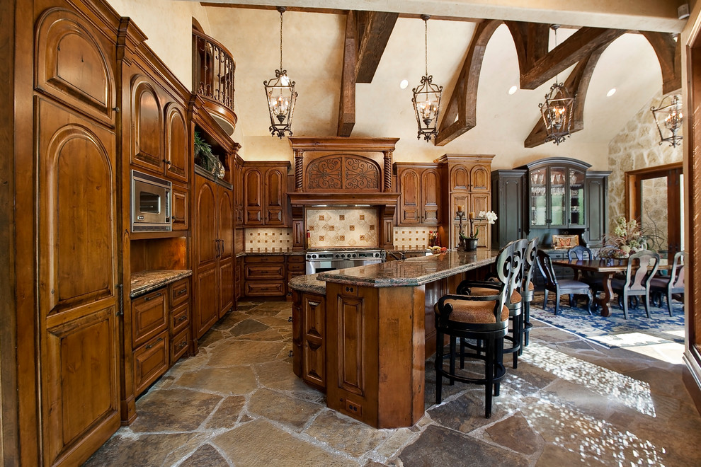 Example of a tuscan kitchen design in Dallas