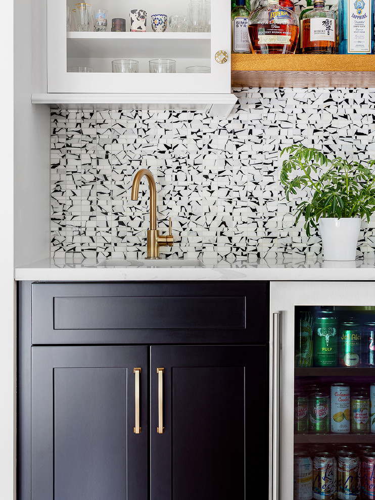 Inspiration for a transitional l-shaped kitchen pantry remodel with an undermount sink, quartzite countertops, stainless steel appliances and an island