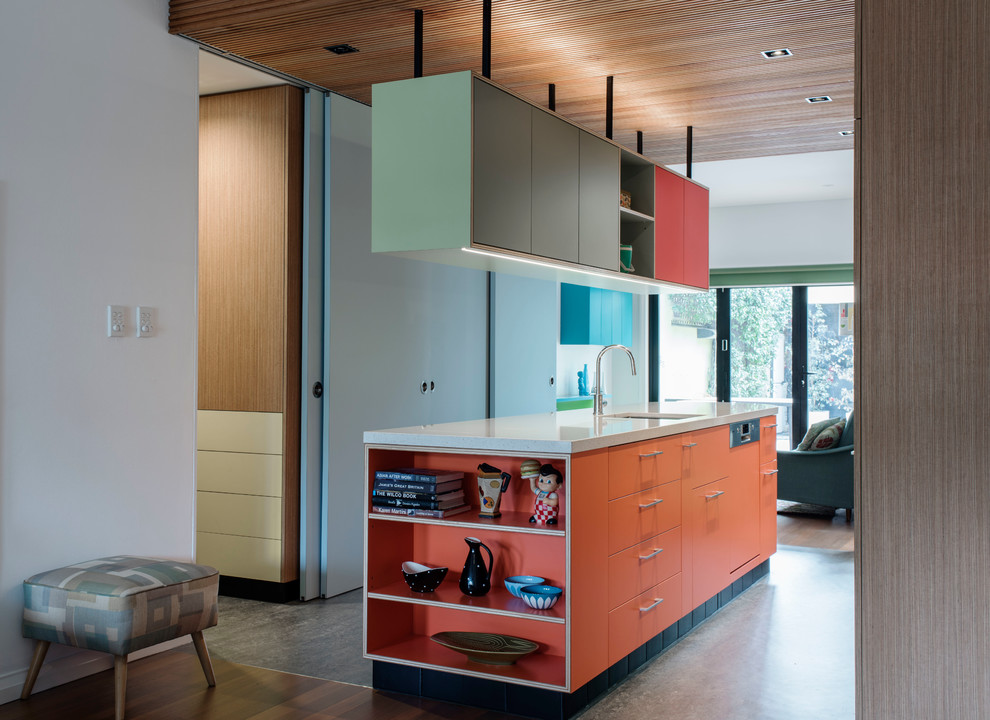 Идея дизайна: параллельная кухня среднего размера в современном стиле с кладовкой, одинарной мойкой, плоскими фасадами, оранжевыми фасадами, столешницей терраццо, техникой из нержавеющей стали, полом из линолеума и островом