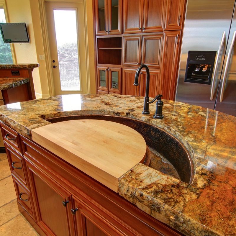 Trendy kitchen photo in Portland with an undermount sink, granite countertops and an island