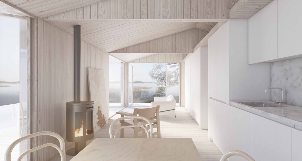 На фото: прямая кухня-гостиная среднего размера в скандинавском стиле с одинарной мойкой, плоскими фасадами, белыми фасадами, мраморной столешницей, серым фартуком, белой техникой и светлым паркетным полом