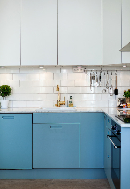 Example of a mid-century modern kitchen design in Stockholm