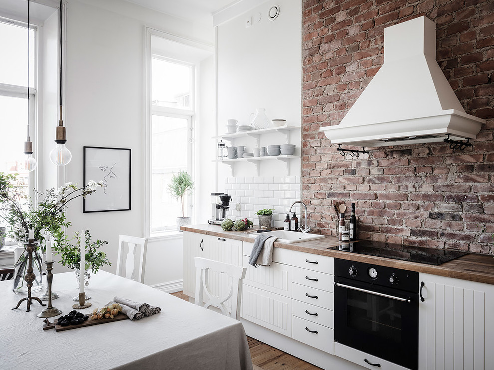 Inspiration for a scandinavian kitchen in Gothenburg with black appliances.