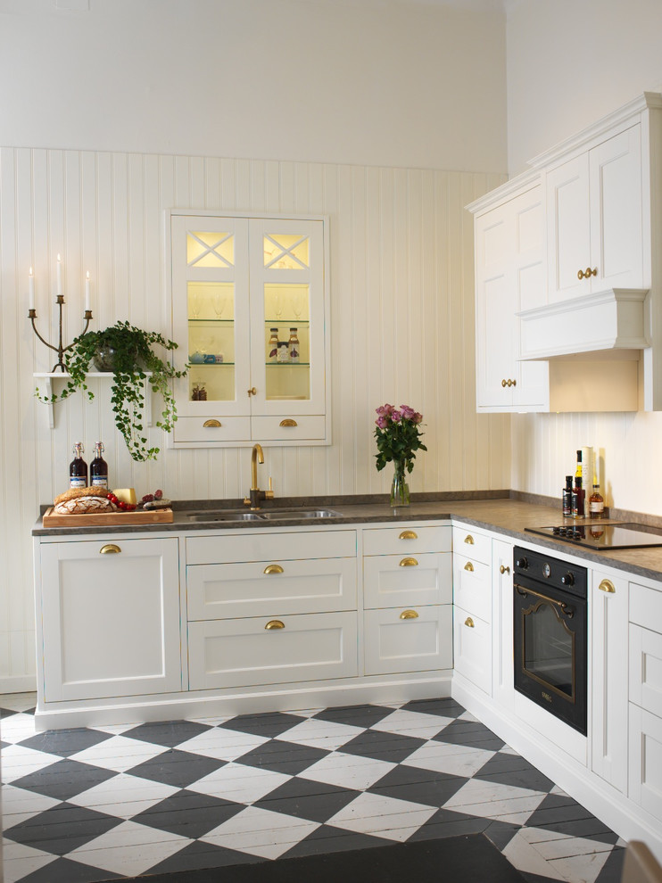 Example of a transitional kitchen design in Malmo
