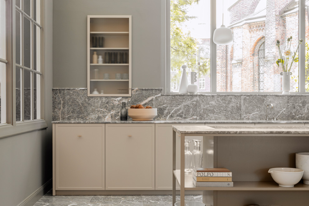 This is an example of a large scandinavian single-wall open plan kitchen in Copenhagen with a single-bowl sink, beige cabinets, marble worktops, marble flooring, an island, grey floors and grey worktops.