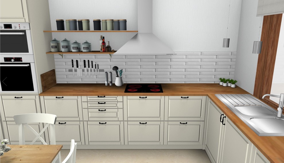Inspiration för ett mellanstort lantligt kök, med en dubbel diskho, luckor med infälld panel, vita skåp, träbänkskiva, vitt stänkskydd, stänkskydd i keramik, vita vitvaror och laminatgolv