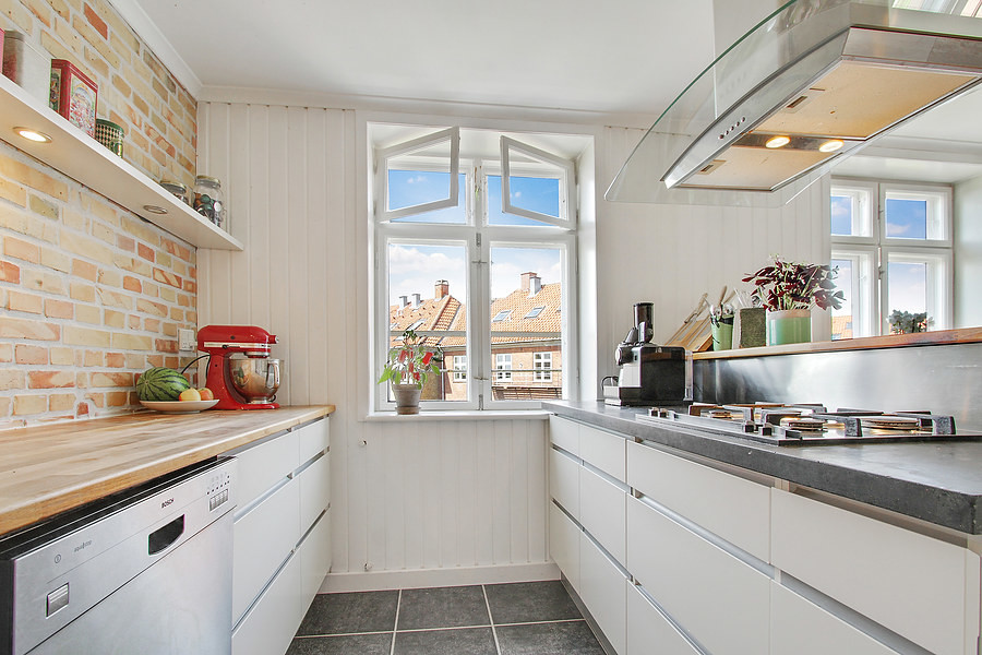 Photo of a small scandi galley kitchen in Copenhagen.