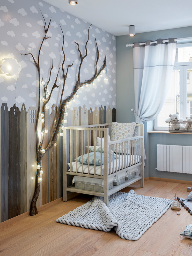Inspiration for a transitional gender-neutral light wood floor and beige floor nursery remodel in Other with multicolored walls