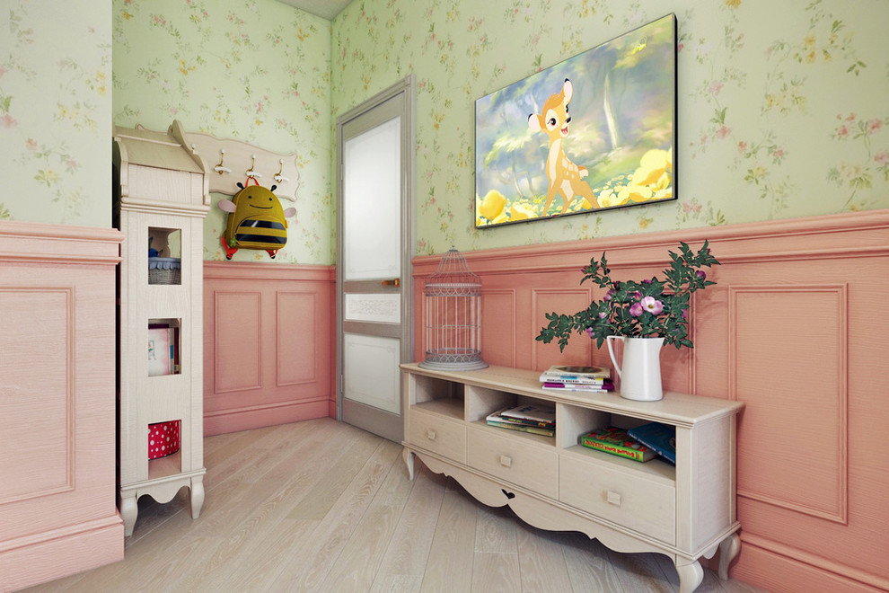 Photo of a mediterranean nursery for girls in Other with green walls and light hardwood flooring.