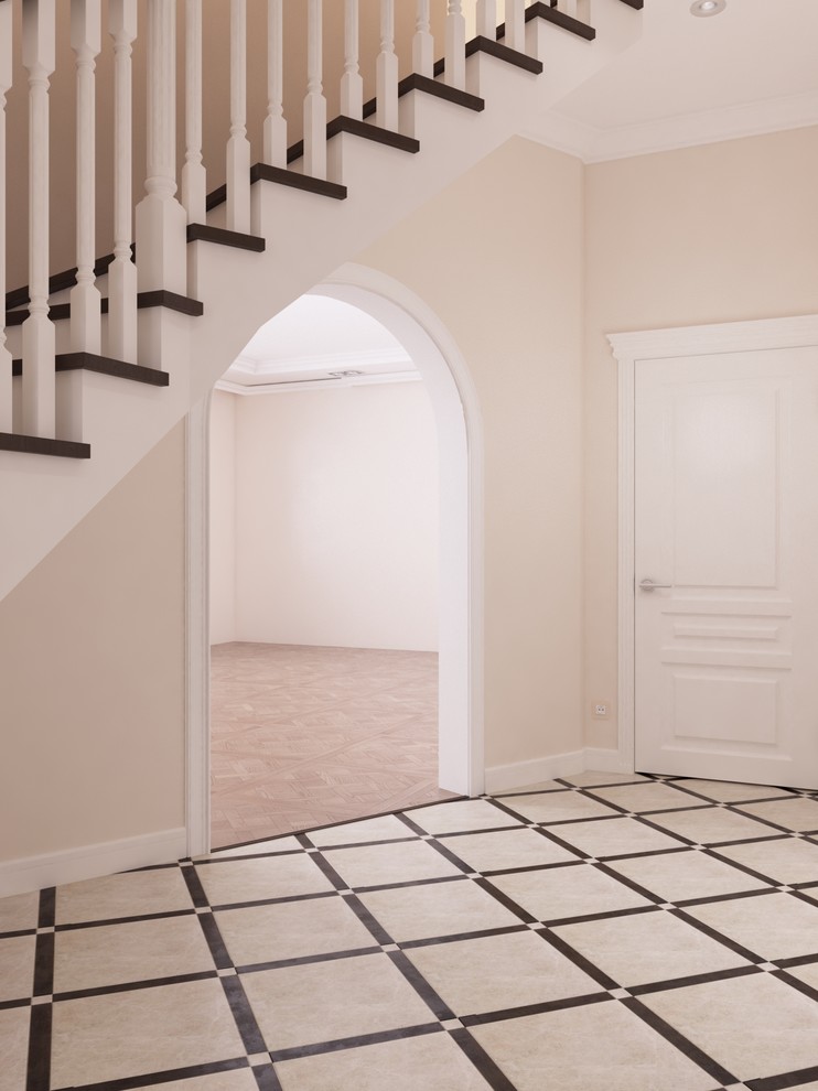 На фото: коридор среднего размера в стиле неоклассика (современная классика) с бежевыми стенами, полом из керамогранита и белым полом с
