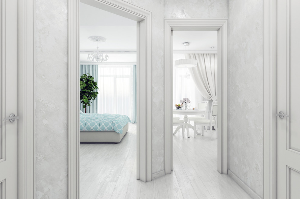 Mid-sized transitional laminate floor, white floor, tray ceiling and wallpaper hallway photo in Other with white walls