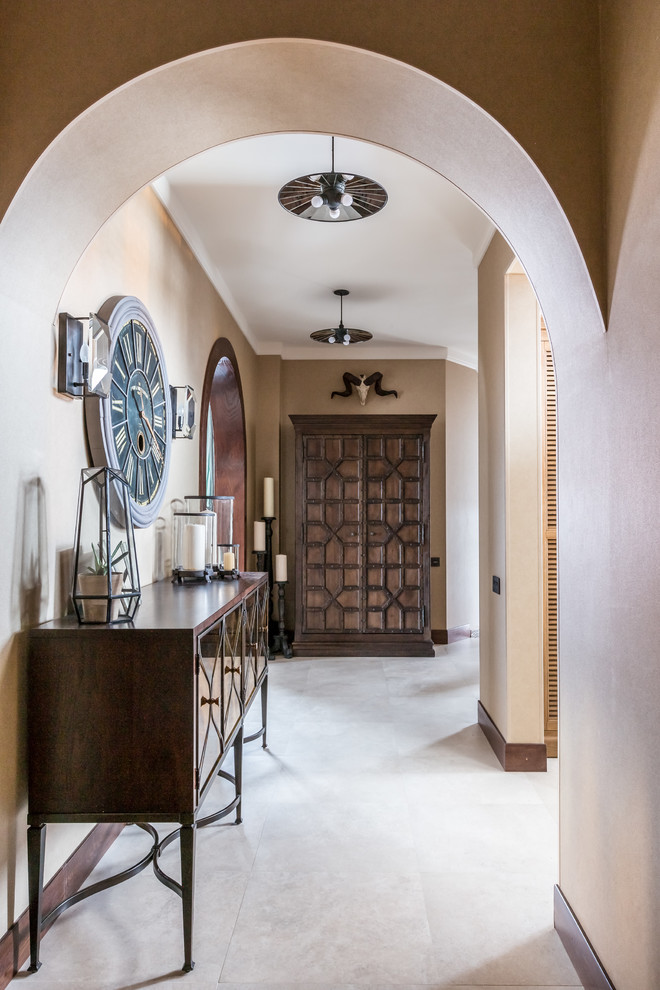 Tuscan hallway photo in Other with beige walls