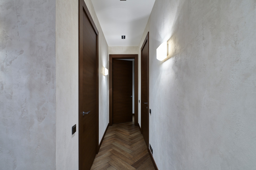 Idée de décoration pour un couloir design de taille moyenne.
