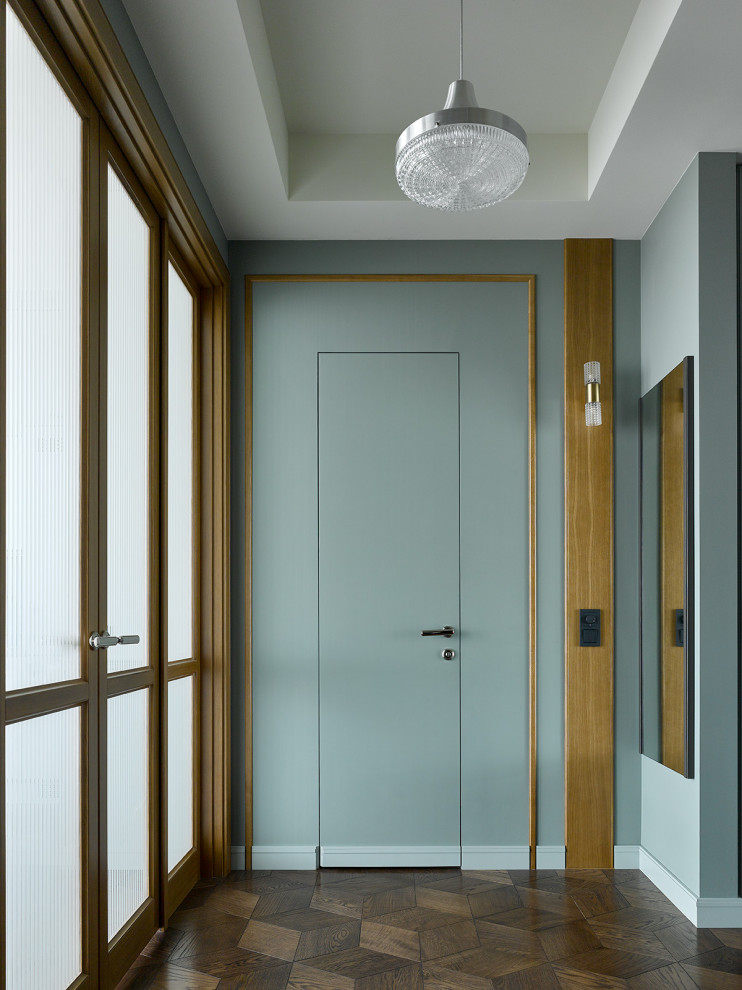 Example of a trendy dark wood floor, brown floor and tray ceiling hallway design in Moscow