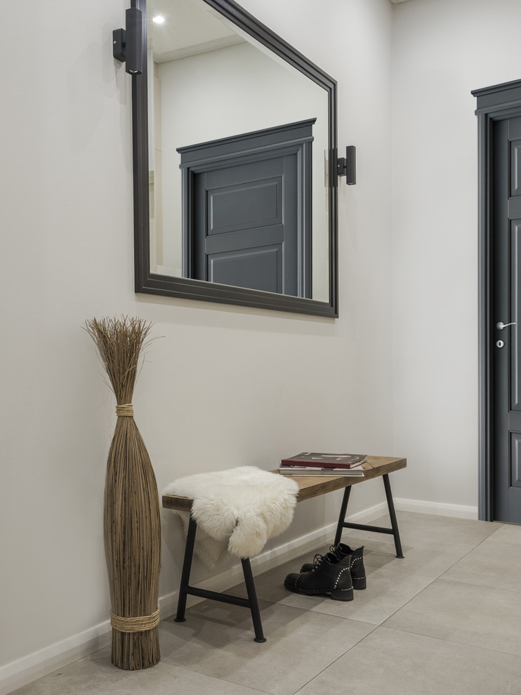 Hallway - contemporary beige floor hallway idea in Moscow with white walls