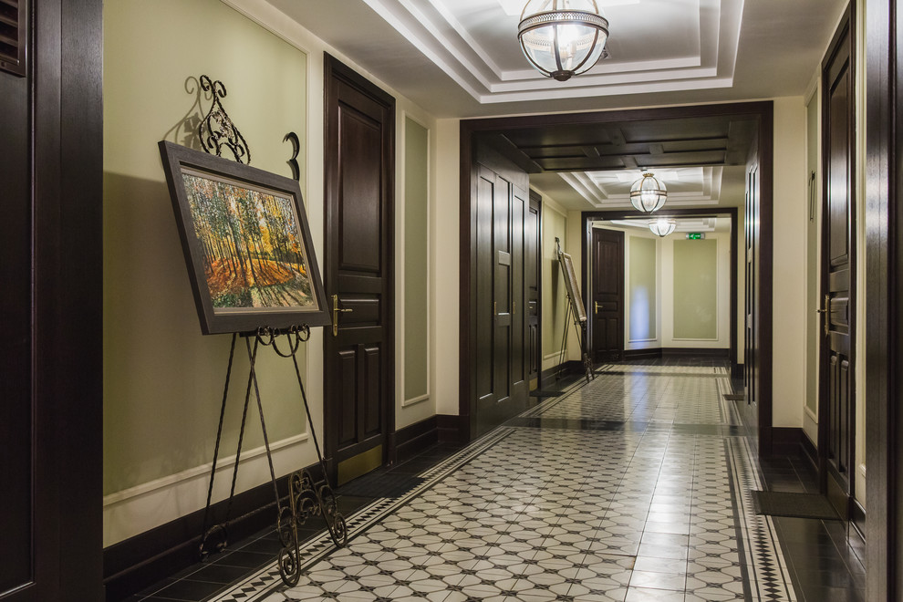 Hallway - large industrial ceramic tile hallway idea in Moscow with green walls