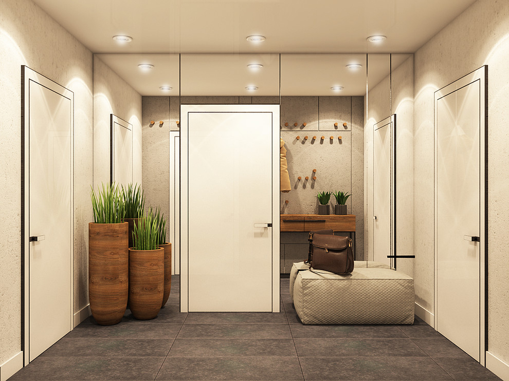 Idéer för små funkis hallar, med grå väggar, betonggolv och grått golv