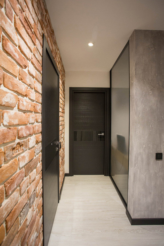 На фото: коридор среднего размера в стиле лофт с белыми стенами, полом из винила и серым полом