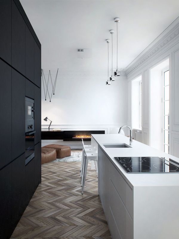Inspiration for a large scandi galley open plan kitchen in Nuremberg with an integrated sink, flat-panel cabinets, white cabinets, black splashback, black appliances, painted wood flooring and an island.