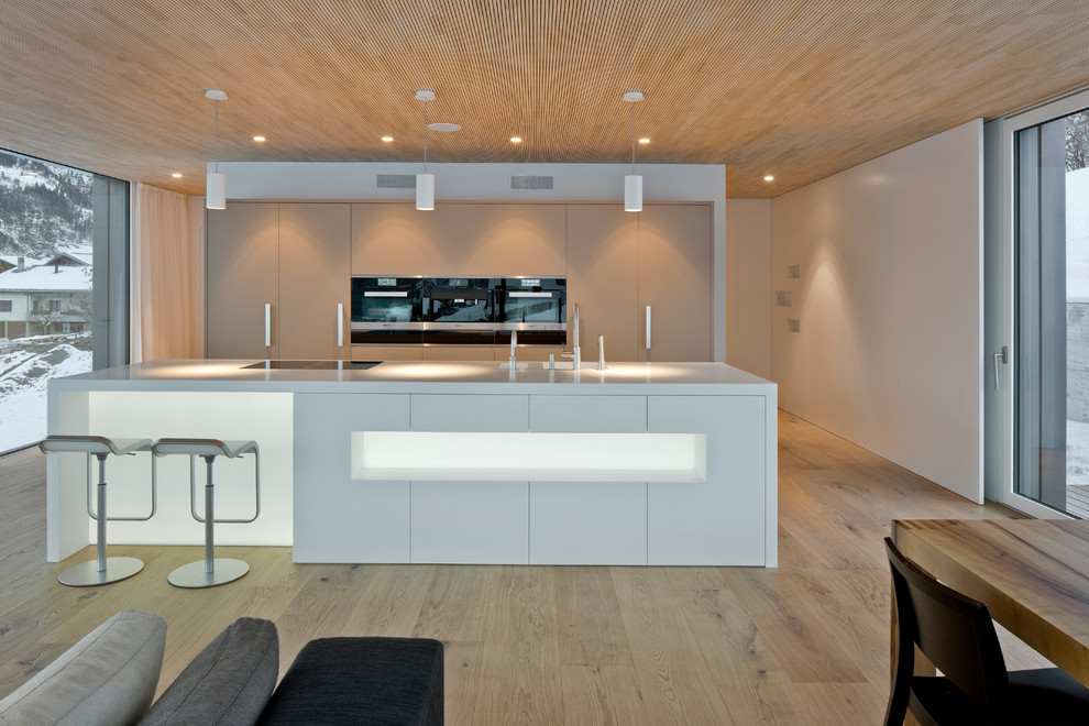 Photo of a modern kitchen in Other with an integrated sink and composite countertops.