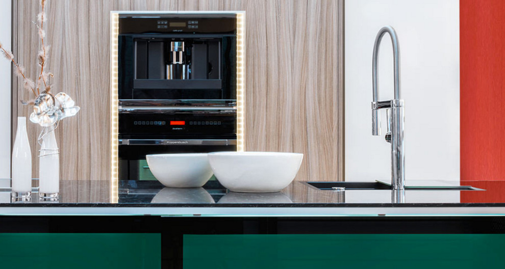 Trendy kitchen photo in Dusseldorf with black appliances