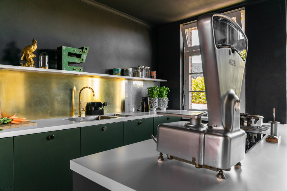 This is an example of a small industrial galley open plan kitchen in Dortmund with a double-bowl sink, flat-panel cabinets, green cabinets, marble worktops, metallic splashback, marble splashback, integrated appliances, ceramic flooring, an island, black floors and white worktops.