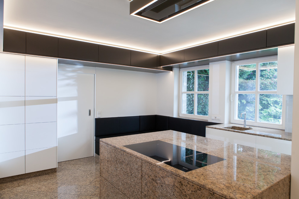 Design ideas for a medium sized contemporary galley enclosed kitchen in Hanover with flat-panel cabinets and an island.
